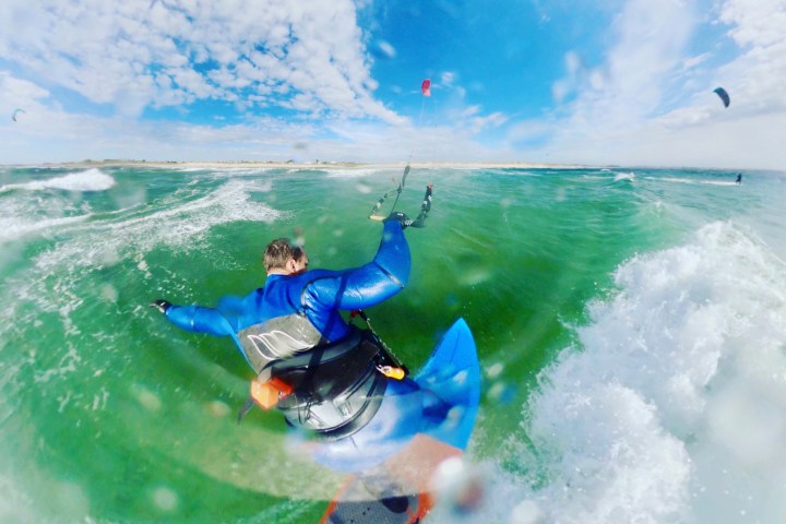 a man riding a wave on a surfboard in the ocean